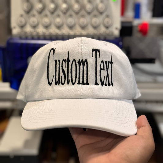Personalized dad hat with Embroidery in black thread.